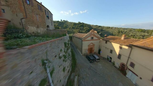 Wonderful medieval village in the Tuscan hills, Italy. Aerial fpv drone