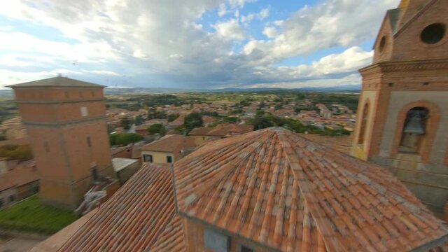 In the alleys of a medieval Italian village. Tuscany and its hills. Aerial fpv drone