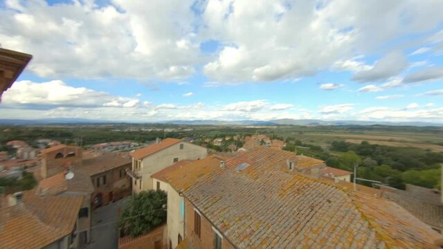 Aerial FPV shot, gorgeous classic small italian village on the Tuscan hills. Tuscany, Sinalunga. Itlay