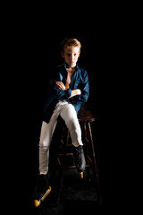 Fototapeta premium Young figure skater dressed in white jeans and blue shirt