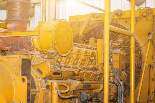 A Very Large Electric Diesel Generator,Fragment Of Yellow Industrial Diesel Engine For Electrical Generator In Power Station