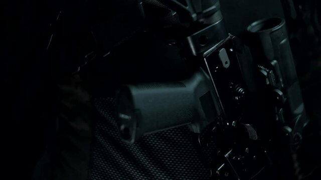 Man in a multicam on a black background with an AK on a tactical belt