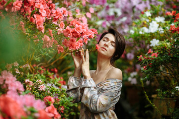 Naklejka premium dreamy girl in a big flower garden