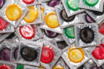 Colorful condoms background.