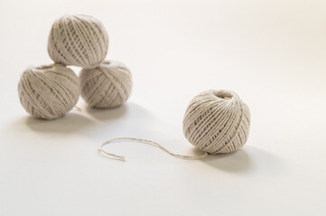 Fototapeta na wymiar Grey balls of woollen grey thread isolated on white background.