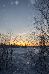 majestic beautiful sunset sunrise in winter mountain landscape, snowfall in the Park.