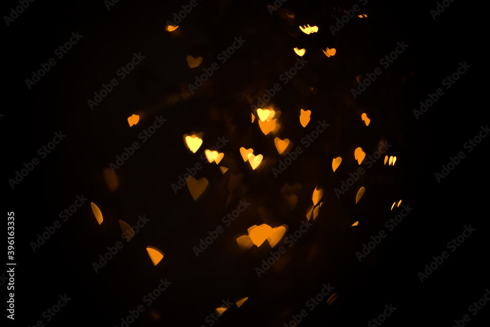 Wall mural Abstract bokeh hearts background wallpaper. lights in the night city