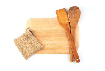 Board for cooking and a wooden spoon on a white background. Culinary background with space to copy.