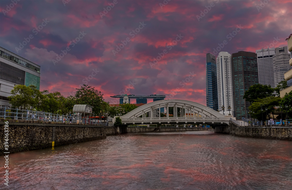 Wall mural A panorama view from a boat on the Singapore river just after sunset towards the Elgin Bridge in Singapore, Asia