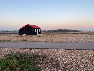 Rye Harbour, East Sussex, UK -  Red Roofed Fishing Hut called Lime Kiln cottage at Rye Harbour...