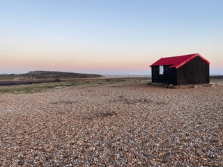 Rye Harbour, East Sussex, UK -  Red Roofed Fishing Hut called Lime Kiln cottage at Rye Harbour...