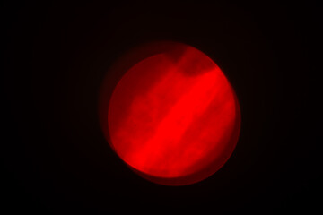 Abstract bokeh background wallpaper. 3d red circle on black background. red bifurcated glare. Red gradient sphere in abstract background. Abstract symbol. red ball on a dark background.