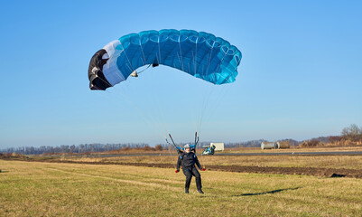 skydiver lands in a field