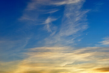 Blue yellow blue sky with Cirrus clouds in the evening