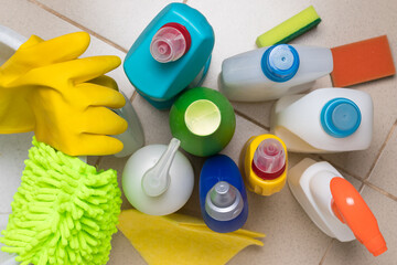 Cleaning products for cleaning chores. Detergent bottles, rubber gloves, rags and sponges