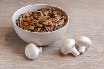home-made buckwheat porridge with mushrooms