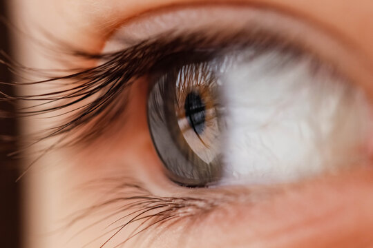 Macro photography of a girl's eye that looks away. Blurred edges.