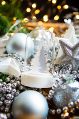 Christmas background with decorations and gift boxes on wooden board