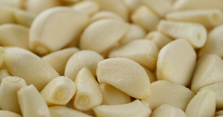 peeled garlic with water drops close up 