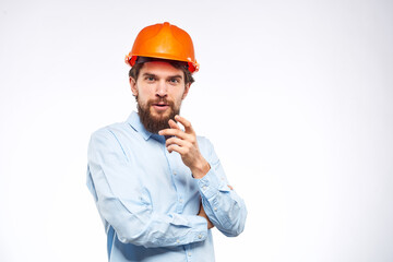 Worker man in orange paint engineer emotions industry construction