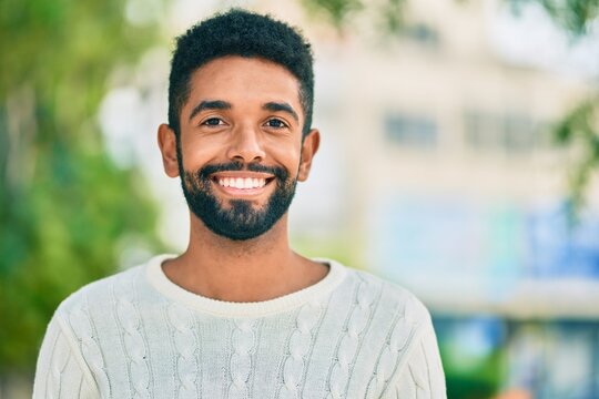 Young african american man smiling happy standing at the park.
