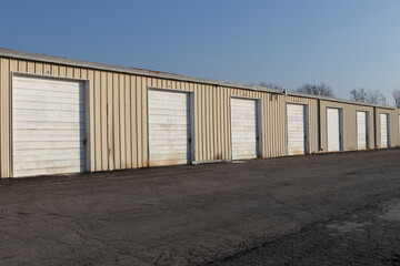 Fototapeta na wymiar Self storage and mini storage garage units deserted, cold, and abandoned.