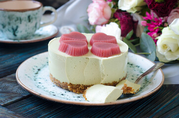 Cheesecake with matcha tea and jelly hearts