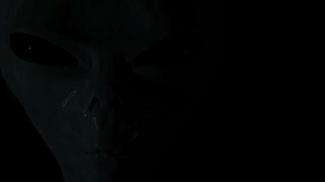 Spooky alien's face and lightning around. 3D rendered animation.