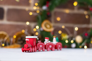 Red train on the backdrop of christmas decorations