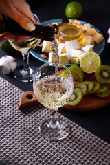 Dinner for two with white wine, cheese, honey and fruit