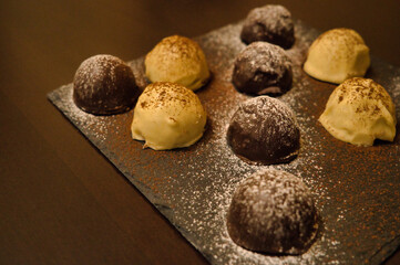 Dark and white chocolate bonbons filled with raspberry and coconut