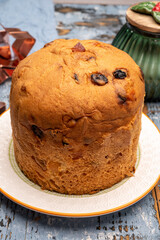 Christmas food, fresh Italian panettone cake made from yeast dough with dried fruits