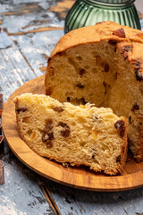Christmas food, fresh Italian panettone cake made from yeast dough with dried fruits