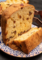 Christmas food, fresh Italian panettone cake made from yeast dough with dried fruits