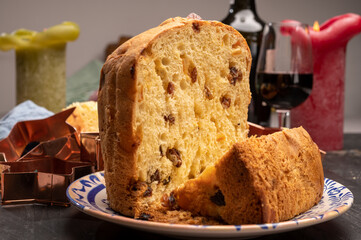 Christmas food, fresh Italian panettone cake made from yeast dough with dried fruits