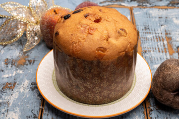 Christmas food, fresh Italian panettone cake made from yeast dough with dried fruits