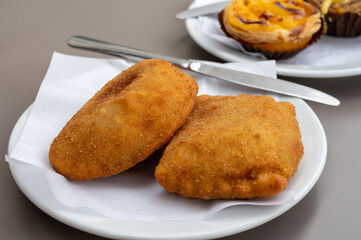Street food in Portugal, savory pastries with meat or fish served for lunch
