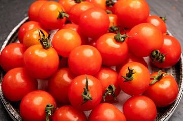 Small red ripe Sweet Enjoy cherry vine tomatoes, Rivolo variety