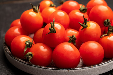 Small red ripe Sweet Enjoy cherry vine tomatoes, Rivolo variety