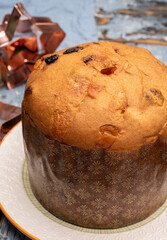 Christmas food, fresh Italian panettone cake made from yeast dough with dried fruits
