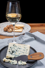 Cheese and wine pairing, french soft blue roquefort cheese and sweet white sauternes wine from...