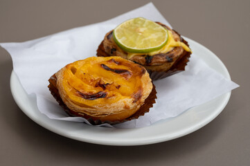 Traditional dessert pastry in Portugal, nata eggs cream cakes with fruits