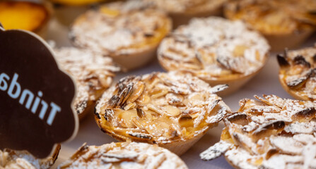 Traditional dessert pastry in Portugal, nata eggs cream cakes with almonds