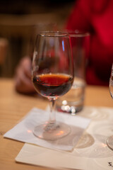 Professional tasting of different fortified dessert ruby, tawny port wines in glasses in porto cellars in Vila Nova de Gaia, Portugal