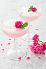 Pink cocktail with rose flowers