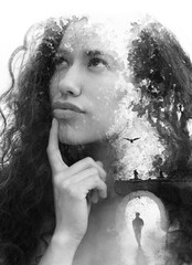 A balck and white concept paintography portrait of a thoughtful young woman with curly hair