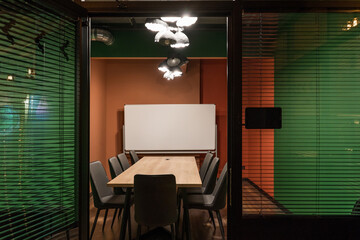 Colored meeting room with big screen