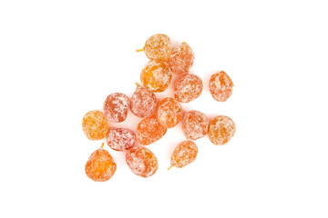 Candied fruits, heap of dried kumquats isolated on white background