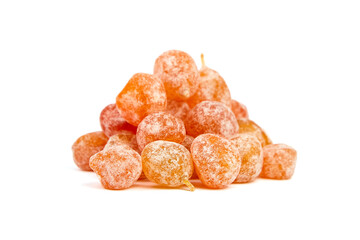 Candied kumquats, heap of dried fruits isolated on white background