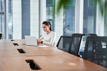 Businesswoman is sitting in the office